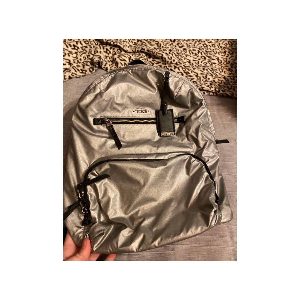 Tumi metallic silver backpack